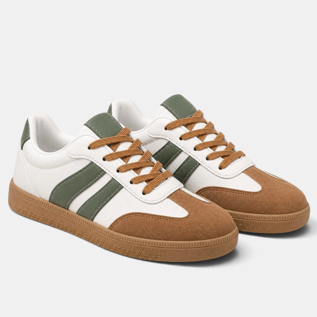A pair of low-top sneakers in white, brown, and olive green. The shoes feature a white leather upper with green side stripes, a brown suede toe cap, matching brown laces, and a brown rubber sole, shown on a light gray background.